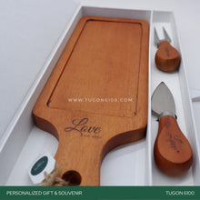 Load image into Gallery viewer, "Nibble Nosh Set" – a delightful set for tasty moments! This personalized wooden gift set features a charming stylish cheese board and two cutlery pieces. Perfect for corporate events, weddings, Valentine's Day, anniversaries, birthdays, or any special occasion. Elevate your nibbles and create lasting memories with this thoughtful set. It's a charming choice for personalized event tokens. Share the joy of nibbling! TUGON 6100 NEGROS OCCIDENTAL