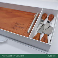 Load image into Gallery viewer, "Grazing Goodness Set" - a classy addition to any celebration. The steak board is crafted for both style and practicality, providing a fantastic backdrop for your favorite cuts. The four cutlery pieces add a touch of elegance to your dining experience.  Whether it's for a corporate event, wedding, Valentine's Day, anniversary, birthday, or any special moment, our set makes for unforgettable event tokens. Crafted with care, it's a charming and thoughtful way to celebrate life's moments. TUGON 6100