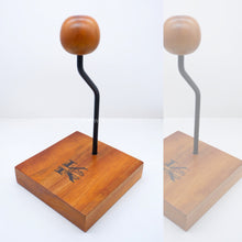 Load image into Gallery viewer, Introducing the HELMET STAND โ a custom-crafted wooden stand that elegantly displays and protects your helmet. Show off your personal style with a personalized engraving of your choice โ the perfect way to showcase your unique gear and add a touch of elegance to any room. ๐๏ธ - TUGON 6100