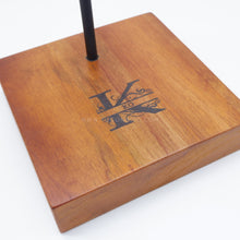 Load image into Gallery viewer, Introducing the HELMET STAND โ a custom-crafted wooden stand that elegantly displays and protects your helmet. Show off your personal style with a personalized engraving of your choice โ the perfect way to showcase your unique gear and add a touch of elegance to any room. ๐๏ธ - TUGON 6100