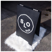 Load image into Gallery viewer, FOLDING STANDEE SIGNAGE is a premium business sign solution for businesses and organizations. Constructed from high-quality wood and acrylic, the sign is designed to be lightweight and movable. Perfect for must-have sign applications, FOLDING STANDEE SIGNAGE offers superior durability and straightforward setup.