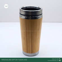 Load image into Gallery viewer, Bamboo Tall Thermos Tumbler: Sustainable Sipping 🌿 A go-to thermos tumbler, designed for those who love both function and elegance. Crafted with a&nbsp;sleek bamboo exterior and a spacious, tall design, THEA holds more of your favorite drinks while keeping them at the perfect temperature—hot or cold—throughout the day.

Whether you&#39;re powering through a busy workday, heading out on an adventure, or simply unwinding at home, THEA offers the perfect blend of style, durability, and eco-conscious living.
