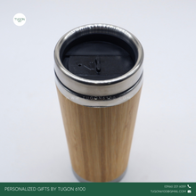 Load image into Gallery viewer, Bamboo Tall Thermos Tumbler: Sustainable Sipping 🌿 A go-to thermos tumbler, designed for those who love both function and elegance. Crafted with a&nbsp;sleek bamboo exterior and a spacious, tall design, THEA holds more of your favorite drinks while keeping them at the perfect temperature—hot or cold—throughout the day.

Whether you&#39;re powering through a busy workday, heading out on an adventure, or simply unwinding at home, THEA offers the perfect blend of style, durability, and eco-conscious living.
