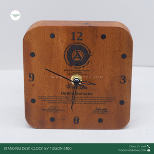 This clock is crafted from high-quality mahogany wood and perfect for adding a personal touch to your workspace. This elegant timepiece isn't just functional; it's a statement piece that brings warmth and character to any desk. Personalize it with a name or special message, making it a thoughtful gift for yourself or a loved one. It's more than just a clock; it's a daily reminder of the moments that matter. Whether for home or office, let this unique desk clock be your go-to for keeping time stylishly.