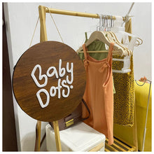Load image into Gallery viewer, Hanging Round Signage is a lightweight, customizable business sign perfect for showcasing your brand. Its unique round shape ensures visibility and provides a distinctive look to any client-facing space. Personalize the sign with a logo, message, or brand colors to make a powerful, lasting impression.  Materials: Base: Round Shaped Wood Details: 3mm Acrylic  We can use your own business logo.
