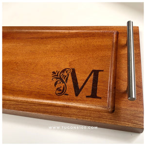This handmade rectangular tray gives you a beautiful way to serve your steaks. It has grooves on the sides to catch the steak's juices and it has handles for easy hold. A perfect idea for holiday gifts, wedding souvenirs.  Made of: Mahogany Wood Dimension: 8 in wide, 15 in long, 0.75 in thick  With FREE custom design of your choice. For your preferred design, please contact us on our facebook page, Tugon 6100.  LEAD TIME: 7-10 BUSINESS DAYS. We accept bulk orders.